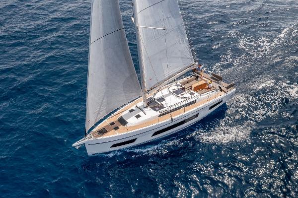 Slide: The Image of 2024 Dufour 41 sailboat cruising on open water. - 5