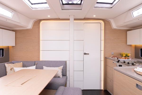 Slide: The Image of Modern interior of 2024 Dufour 41 yacht with skylights and sleek design. - 9