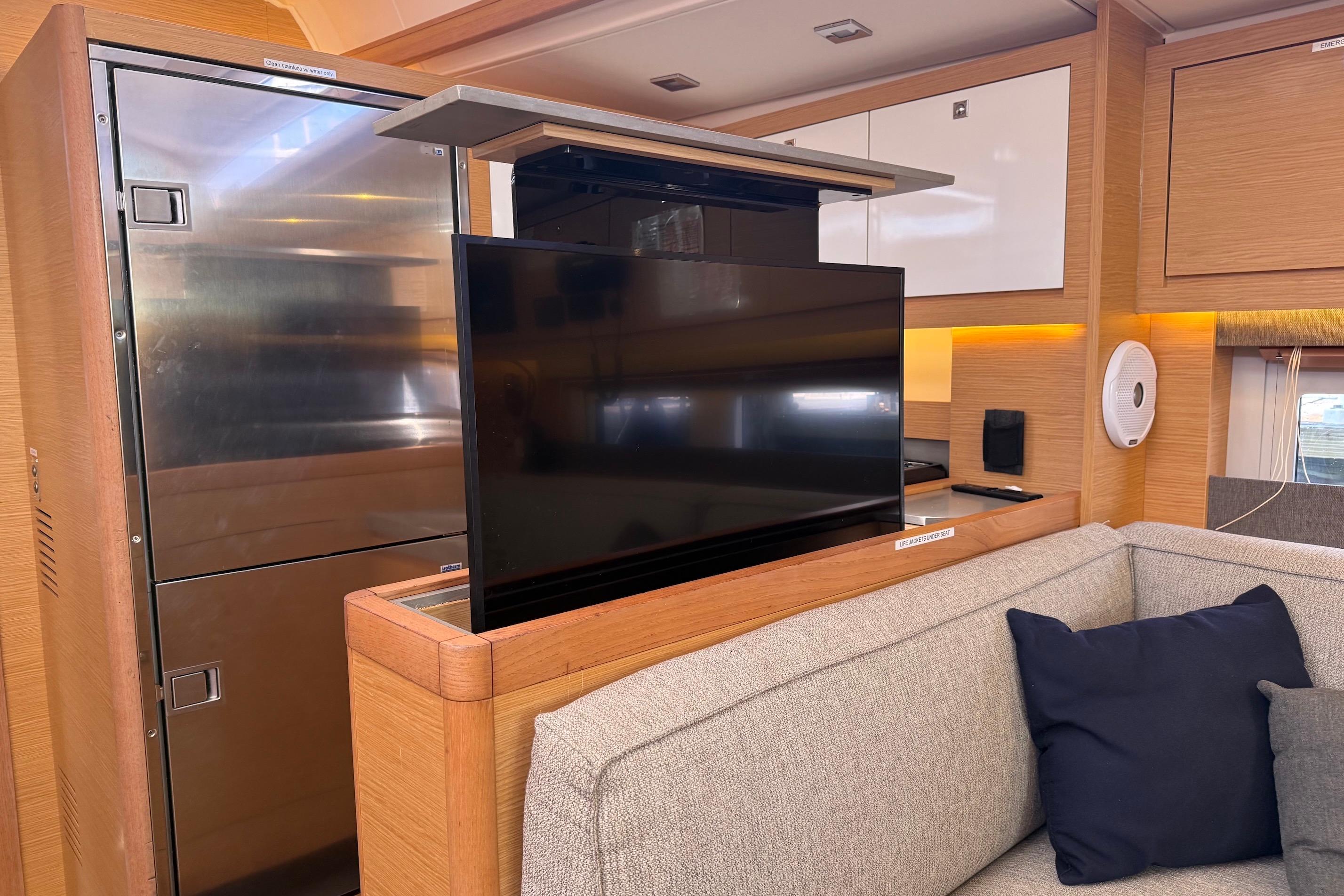 Slide: The Image of Modern interior of 2022 Dufour 530 yacht with pop-up TV and sleek design. - 28