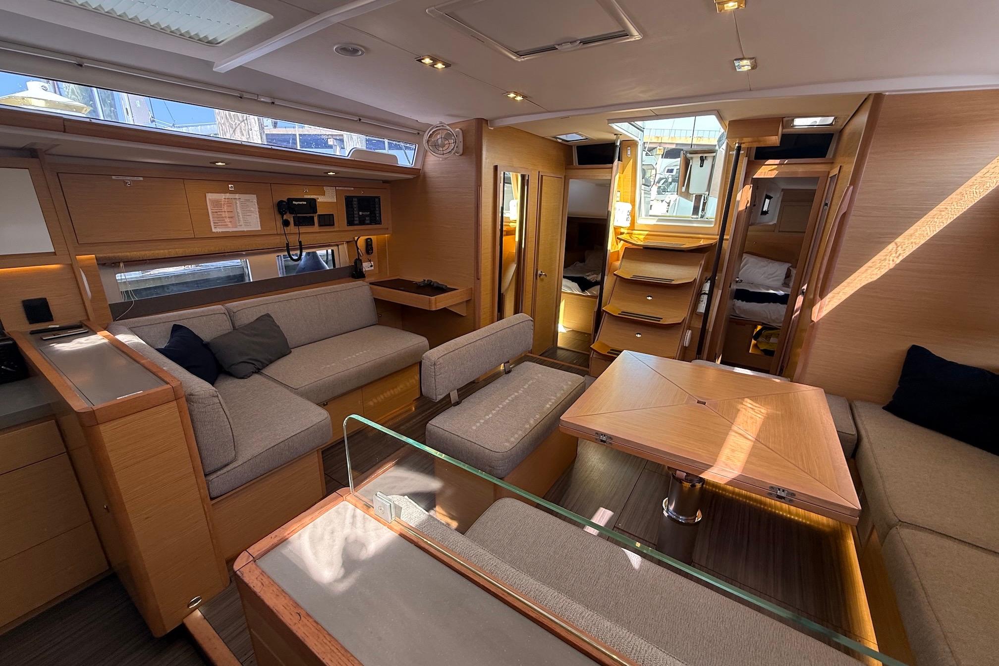 Slide: The Image of Luxurious interior of 2022 Dufour 530 yacht with modern furnishings and ample natural light. - 7