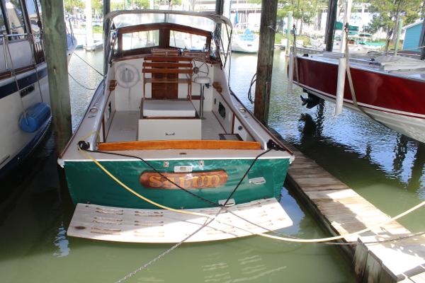Slide: The Image of 1989 Dyer Downeast boat docked in a marina. - 1