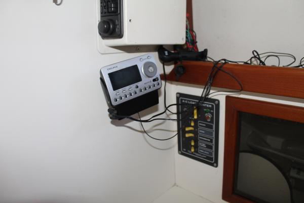 Slide: The Image of 1989 Dyer Downeast boat interior with electronic control panel and radio. - 13