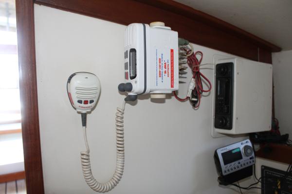 Slide: The Image of Marine radio equipment inside a 1989 Dyer Downeast boat cabin. - 14