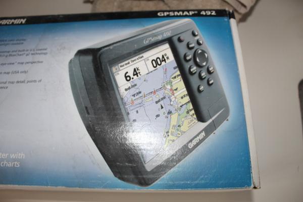 Slide: The Image of Garmin GPSMAP 492 marine GPS device in original packaging. - 19