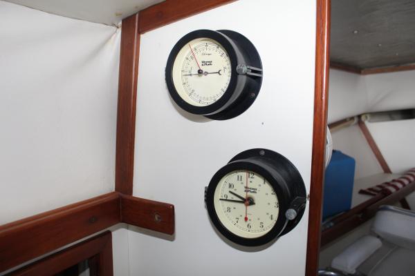 Slide: The Image of Two gauges on a 1989 Dyer Downeast boat interior wall. - 20