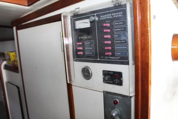 Slide: The Image of 1989 Dyer Downeast boat master power control panel with switches and gauges. - 9