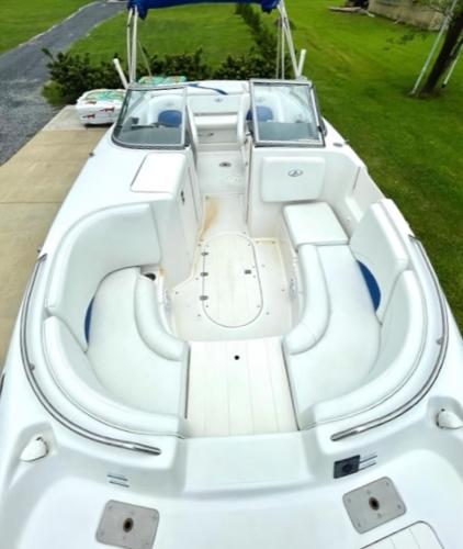 Slide: The Image of 2004 Ebbtide Campione 210 boat with spacious seating and open deck. - 2