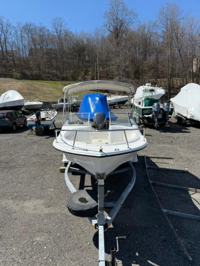 Slide: The Image of 2001 Edgewater 185DC boat on trailer in outdoor storage area. - 6