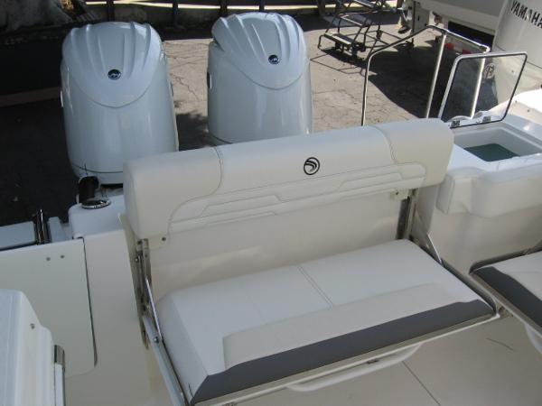 Slide: The Image of 2024 Edgewater 262 CX boat with dual outboard engines and rear seating. - 5