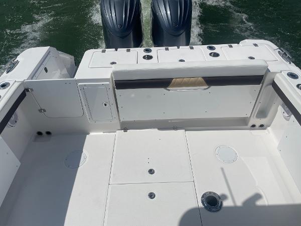 Slide: The Image of 2024 Edgewater 280 CX boat deck with twin outboard motors. - 3