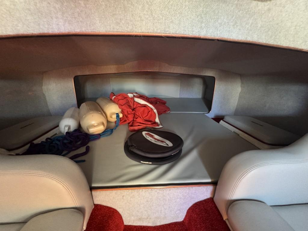 Slide: The Image of Interior cabin of a 2006 Eliminator 33 Daytona boat with storage items. - 22