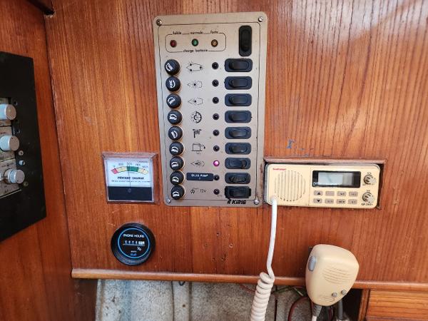 Slide: The Image of Control panel of a 1984 Elite 32 boat with various switches and gauges. - 4