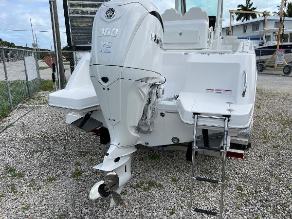 Slide: The Image of 2023 Everglades 235CC boat with Yamaha 300 V6 engine, rear view on gravel. - 32