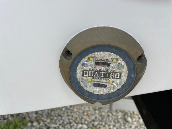 Slide: The Image of Close-up of a 2023 Everglades 235CC boat's Quattro underwater LED light. - 33