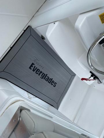 Slide: The Image of 2020 Everglades 255 CC boat interior with branded mat and steering wheel. - 10