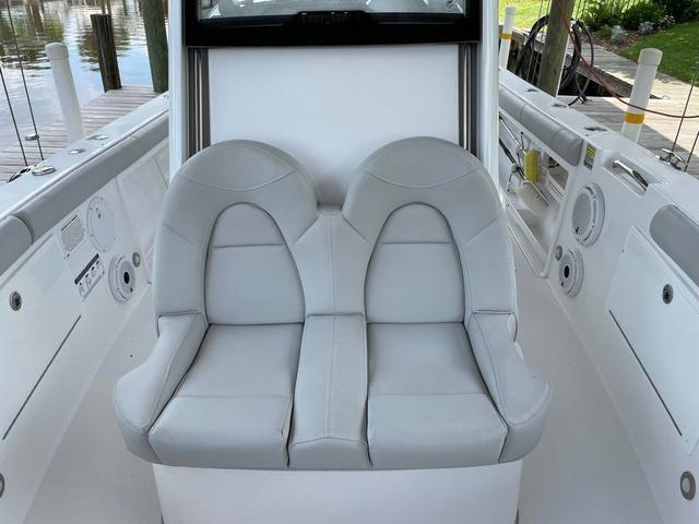 Slide: The Image of 2020 Everglades 255 CC boat with dual gray seats, sleek interior design. - 7