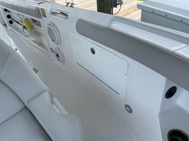 Slide: The Image of Interior view of 2020 Everglades 255 CC boat, featuring seating and storage compartments. - 8