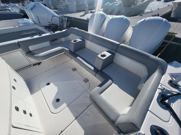 Slide: The Image of 2018 Everglades 360 LXC boat with spacious seating and cup holders. - 43