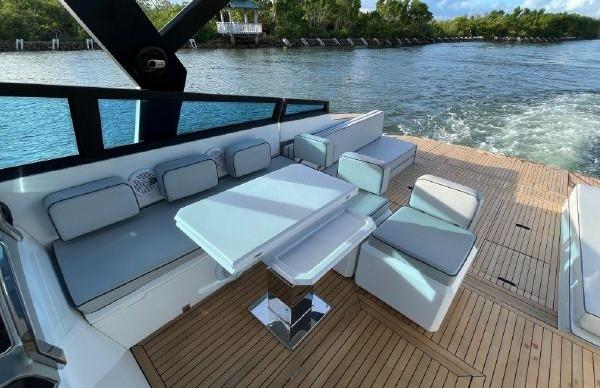 Slide: The Image of 2017 Evo Yachts 43 model, luxury yacht deck with seating and table, cruising on water. - 10