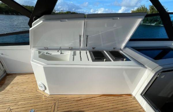 Slide: The Image of Outdoor kitchen on a 2017 Evo Yachts 43, featuring a sink and grill. - 15