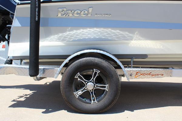 Slide: The Image of 2022 Excel Bay Pro 203 boat trailer with black alloy wheel. - 11