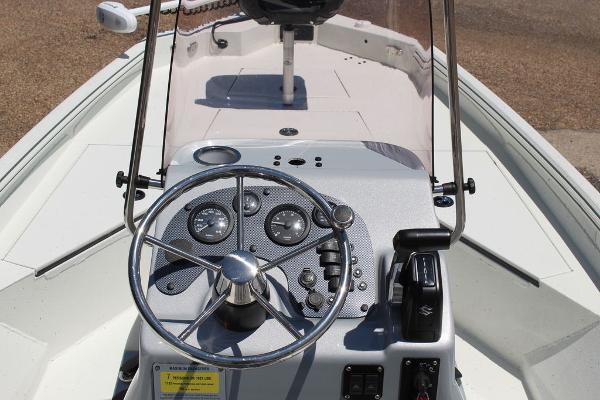 Slide: The Image of 2022 Excel Bay Pro 203 boat console with steering wheel and controls. - 16