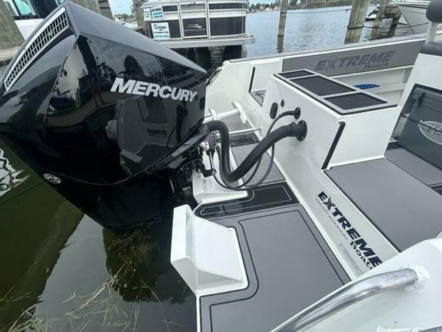 Slide: The Image of Extreme Boats 645 21' Center Console Motor Starboard view with motor and boarding - 5254807