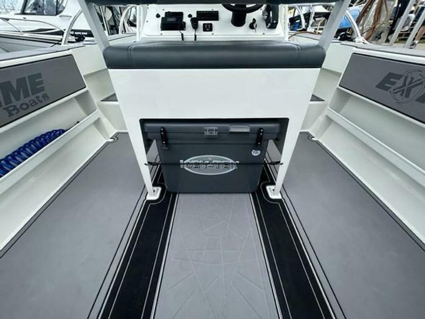 Slide: The Image of Extreme Boats 645 21' Center Console Stern view View of helm seating with cooler below - 5254820