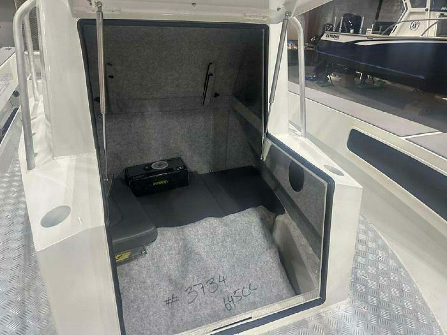 Slide: The Image of Storage and Head on the 2025 Extreme Boats 645 21' Center Console 2025 Extreme Boats 645 21' Center Console Stroage and Head - 5254797