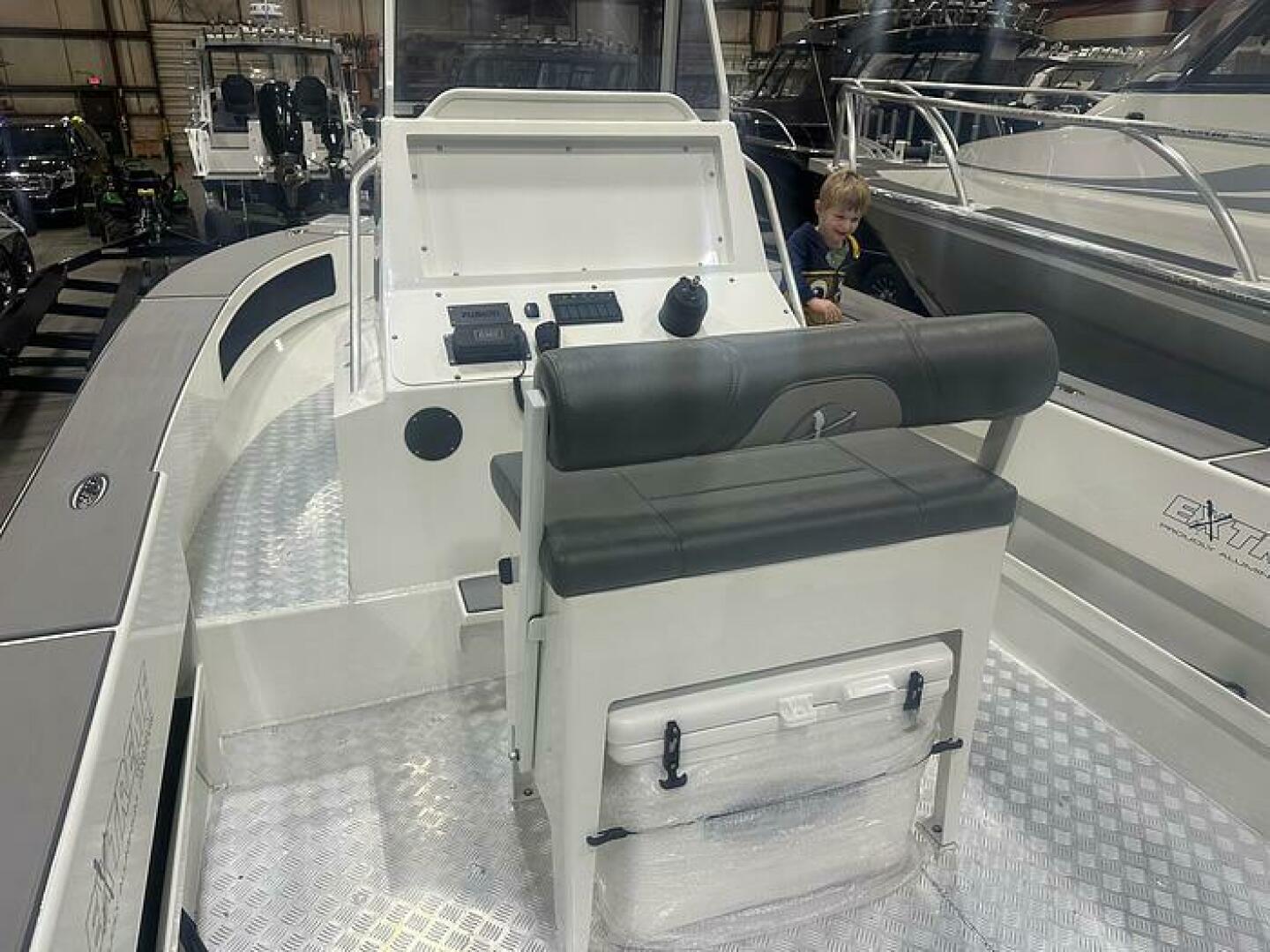 Slide: The Image of 2025 Extreme Boats 645 21' Center Console Cockpit View with Plate Flooring Plate Flooring on the 2025 Extreme Boats 645 21' Center Console Plate Floor and Flip Flop Seating - 5254788