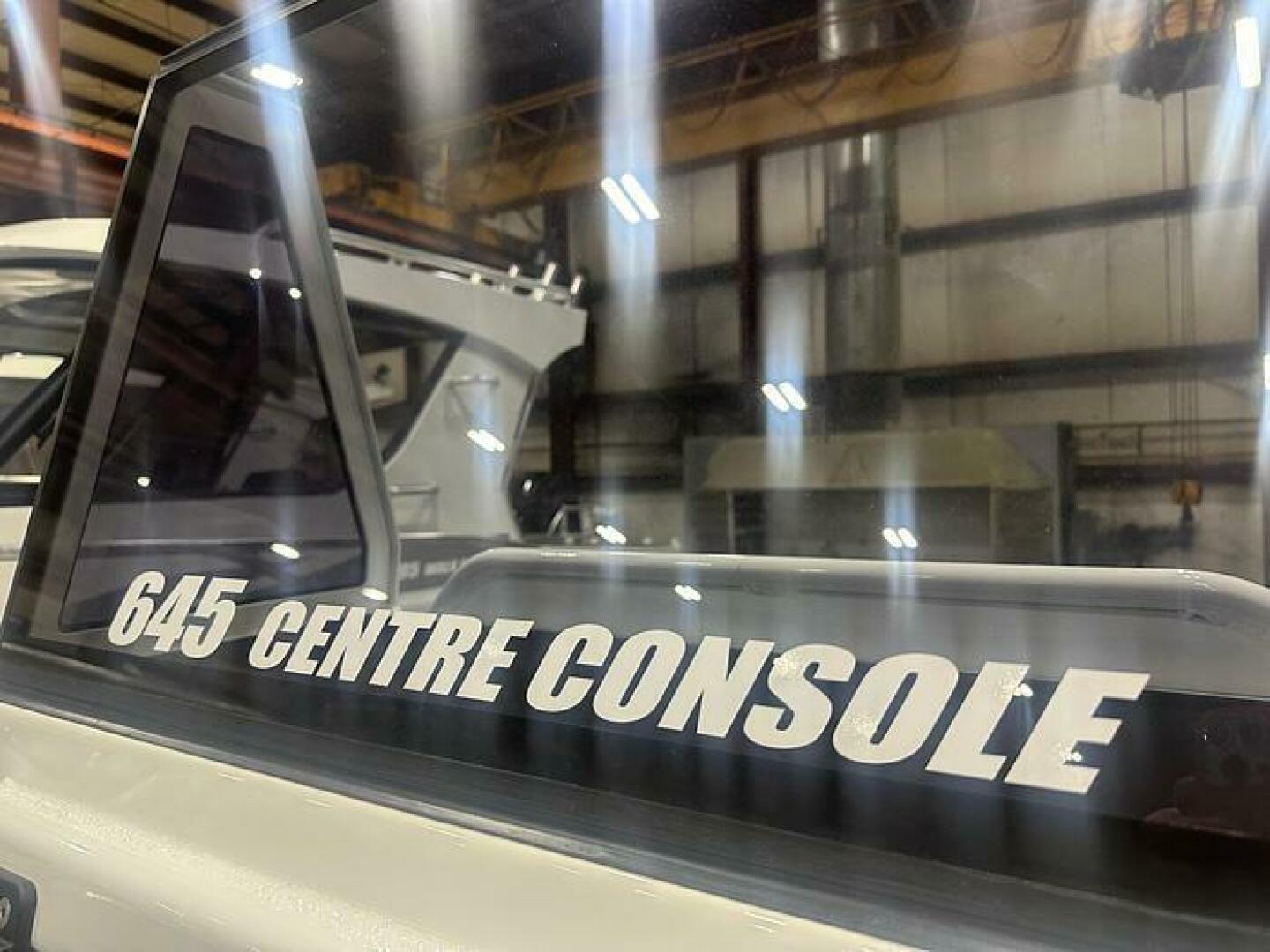 Slide: The Image of Glass Window on the 2025 Extreme Boats 645 21' Center Console 2025 Extreme Boats 645 21' Center Console Window  - 5254798