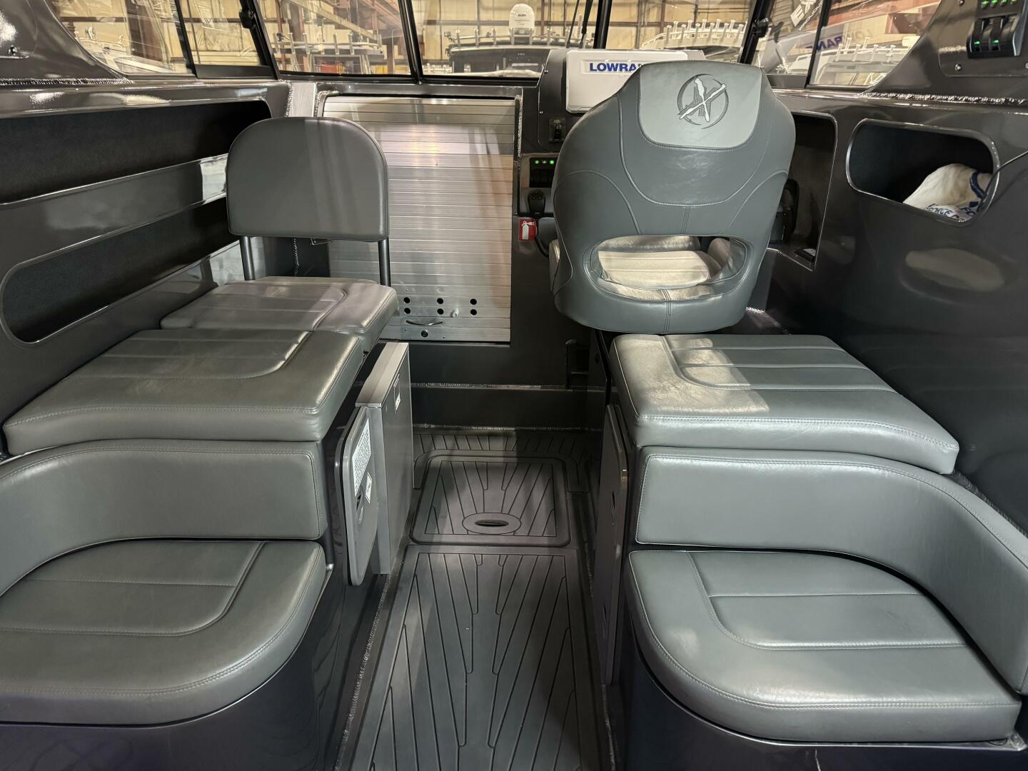 Slide: The Image of Pilot house Helm and companion seating area on this 2020 Extreme Boats 795 Walk Around for sale by Parma Marine (440) 221-9001 - 5311269