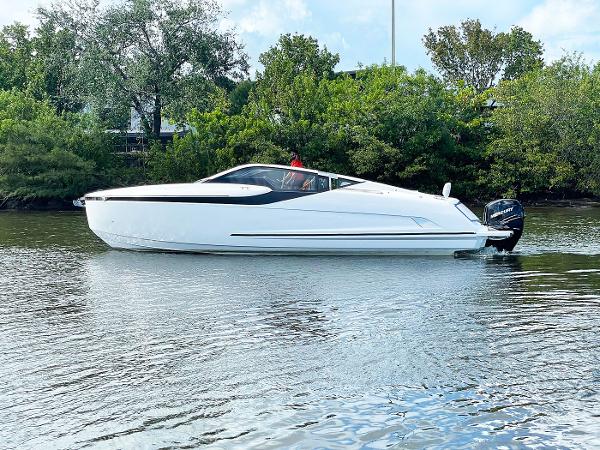 Slide: The Image of 2021 Fairline F Line 33 luxury motor yacht on calm water. - 0