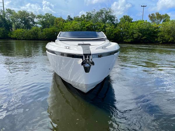 Slide: The Image of 2021 Fairline F Line 33 luxury yacht on calm water. - 1
