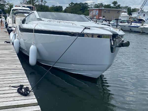 Slide: The Image of 2022 Fairline F//Line 33 yacht docked at a marina, showcasing sleek design and modern features. - 1