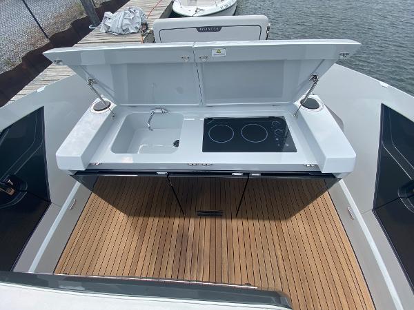 Slide: The Image of Outdoor kitchen on 2022 Fairline F//Line 33 yacht with sink and stove. - 10