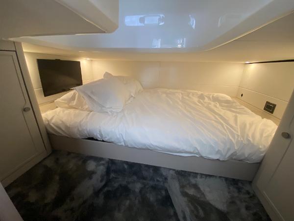 Slide: The Image of Luxurious cabin interior of 2022 Fairline F//Line 33 yacht with cozy bed and TV. - 14