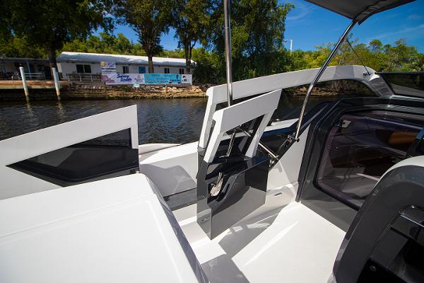 Slide: The Image of 2021 Fairline F Line 33 yacht interior with open door, dockside view. - 30