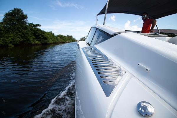 Slide: The Image of 2021 Fairline F Line 33 cruising on a river. - 31
