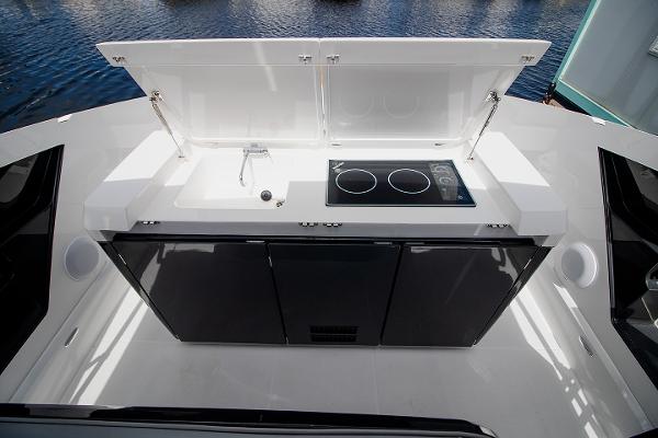Slide: The Image of Outdoor kitchenette on 2021 Fairline F Line 33 yacht with sink and stove. - 33