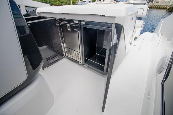 Slide: The Image of 2021 Fairline F Line 33 yacht with open storage compartments. - 35