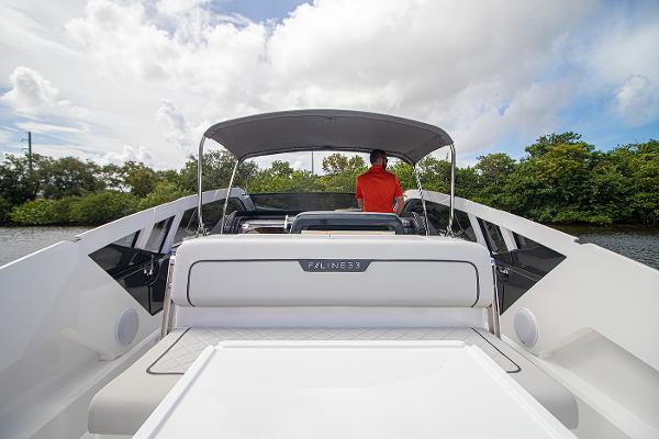 Slide: The Image of 2021 Fairline F Line 33 luxury yacht with canopy and rear seating. - 37