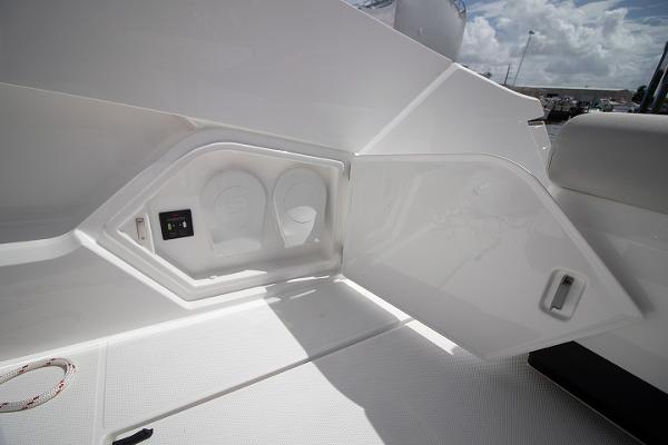 Slide: The Image of Fairline F Line 33 2021 boat interior storage compartment with cup holders. - 45