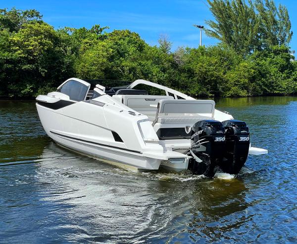 Slide: The Image of 2021 Fairline F Line 33 boat with twin Mercury 350 engines on a calm river. - 5