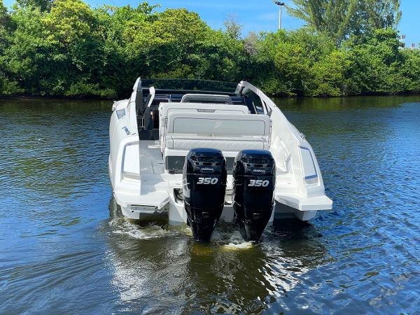 Slide: The Image of 2021 Fairline F Line 33 boat with twin 350 horsepower engines on water. - 6