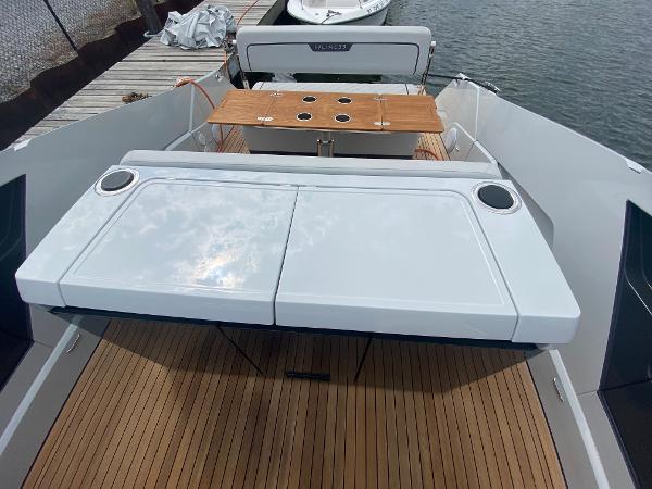 Slide: The Image of 2022 Fairline F//Line 33 yacht with sleek deck and modern seating area. - 9
