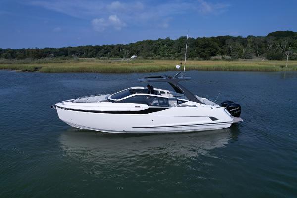 Slide: The Image of 2023 Fairline F//Line 33 Outboard luxury yacht on calm water. - 1