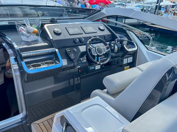 Slide: The Image of 2023 Fairline F//Line 33 Outboard boat cockpit with modern controls and seating. - 10