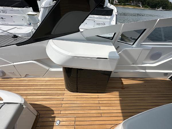 Slide: The Image of 2023 Fairline F//Line 33 Outboard boat with teak deck and sleek white interior. - 12