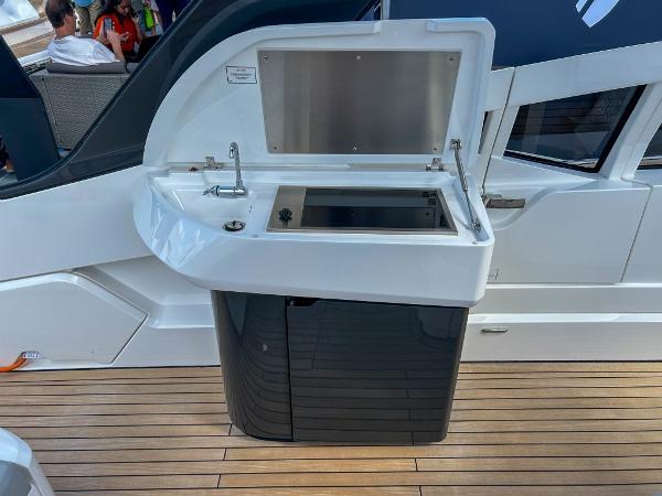 Slide: The Image of 2023 Fairline F//Line 33 Outboard yacht with an open outdoor kitchenette. - 18